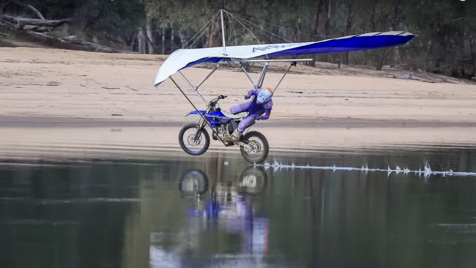 A moto hang glider crashing into a river